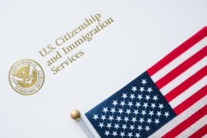 USCIS logo with american flag